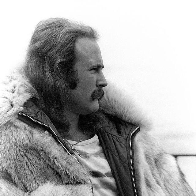 BIG SUR, CA - SEPTEMBER 14-15: Singer David Crosby of Crosby, Stills and Nash looks on in a fur coat during the Big Sur Folk Festival at the Esalen Institue on September 14-15, 1969 in Big Sur, California. (Photo by Robert Altman/Michael Ochs Archives/Getty Images)